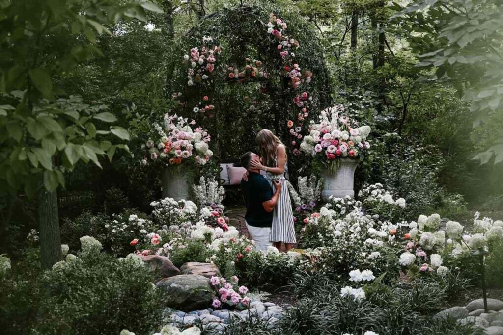 Taylor Swift and Travis Kelce pictured getting engaged surrounded by greenery and florals